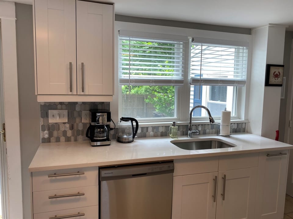 Newly renovated kitchen with dishwasher, SS appliances, granite and coffee maker