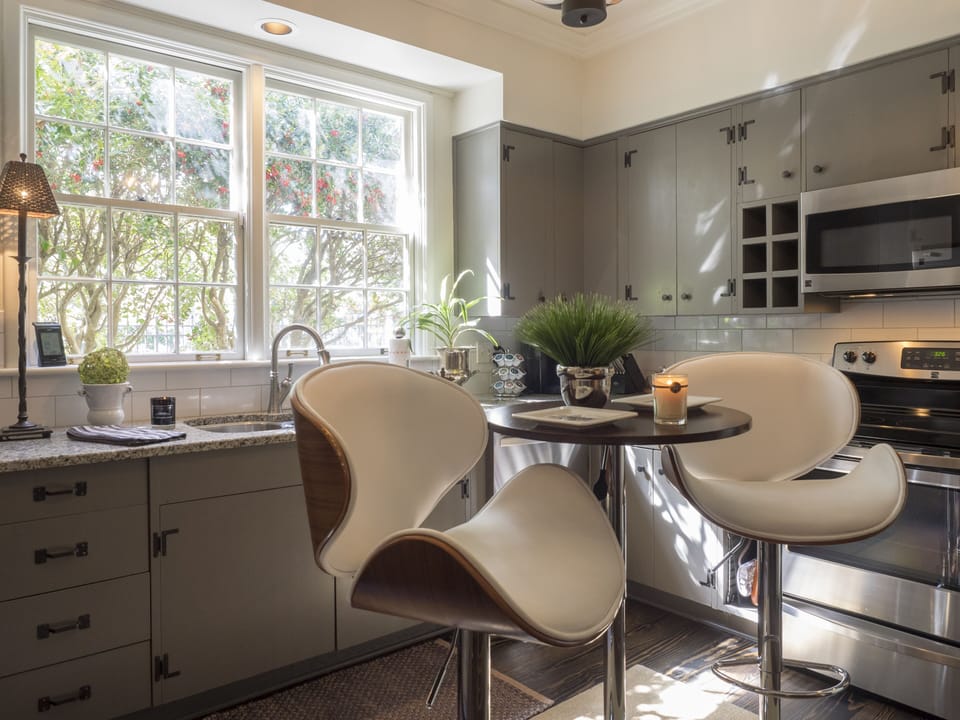 All remodeled kitchen with bar table to enjoy a glass of wine while cooking.