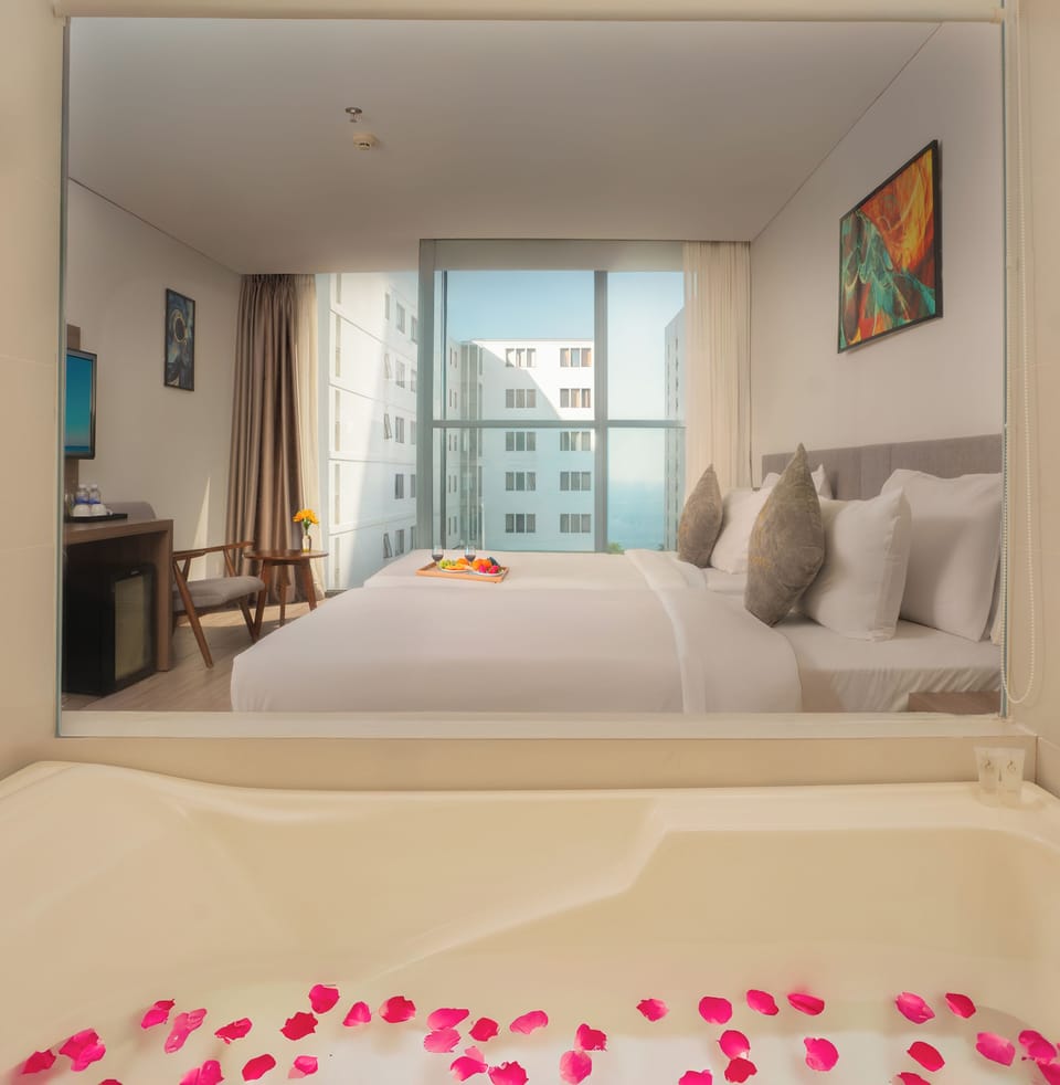Deluxe Double or Twin Room | Minibar, in-room safe, desk, blackout drapes