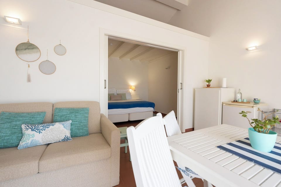 Family Apartment, 1 Bedroom, Sea View | Living area | Flat-screen TV
