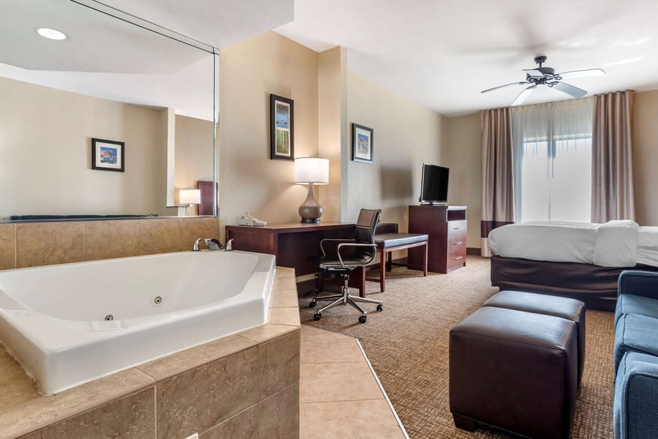 Suite, 1 King Bed, Non Smoking, Hot Tub | Desk, laptop workspace, blackout drapes, iron/ironing board