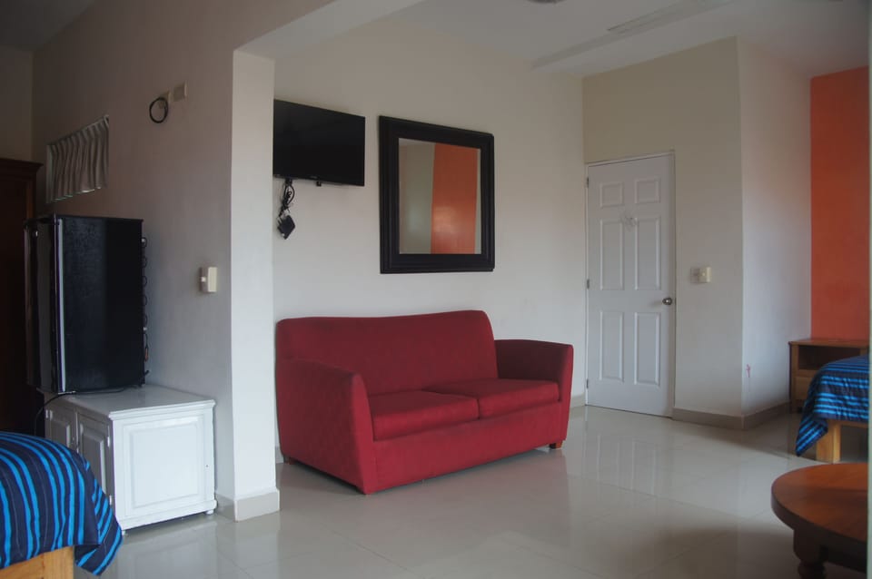 Family Economy Room with Fan | Living area | 32-inch flat-screen TV with cable channels, TV