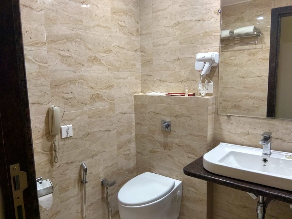 Studio Room - Complimentary Shuttle Pickup and Drop to Sai Baba Temple (Gate 2)(5th Floor) | Bathroom | Shower, free toiletries, bathrobes, slippers