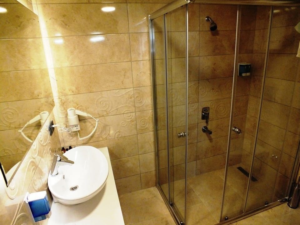 Shower, free toiletries, hair dryer, slippers