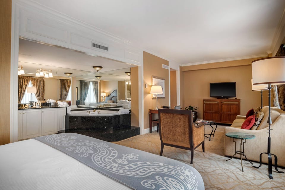 Suite, 1 King Bed, Jetted Tub (Petite) | Premium bedding, minibar, in-room safe, desk