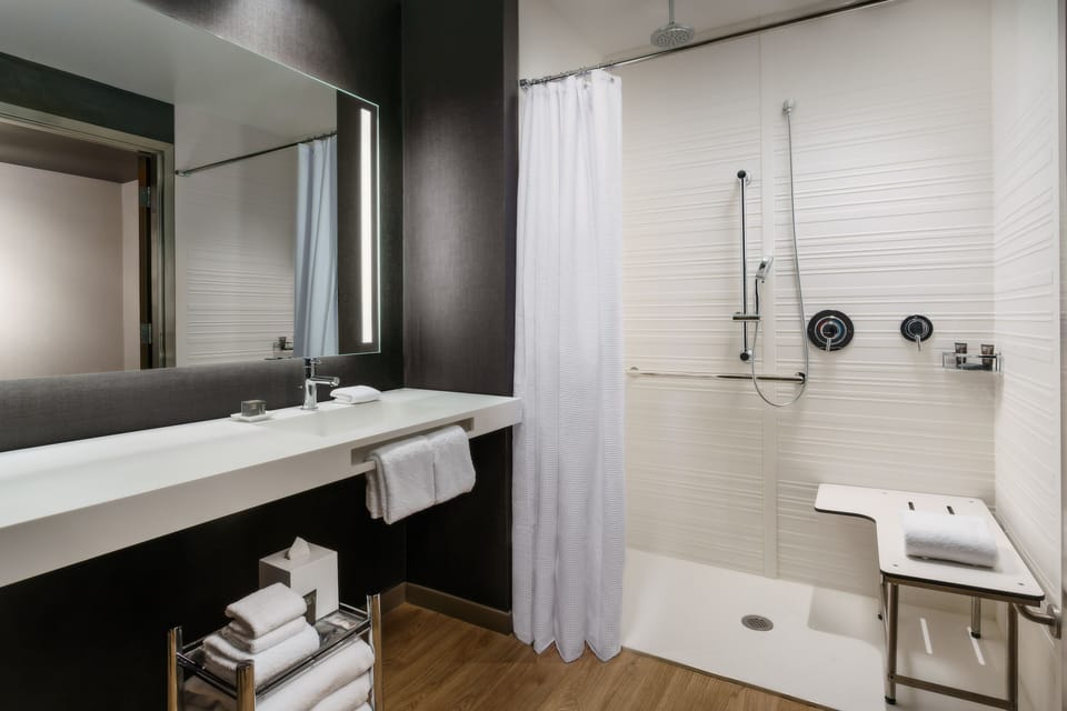 Shower, rainfall showerhead, eco-friendly toiletries, hair dryer