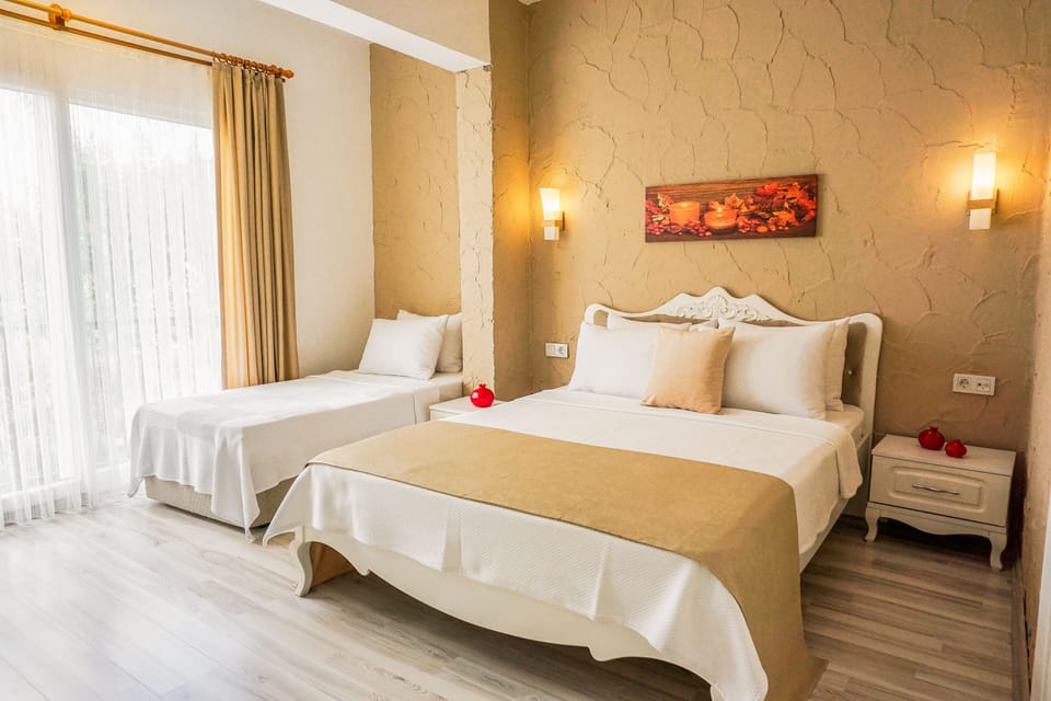 Family Triple Room | Premium bedding, minibar, desk, blackout drapes