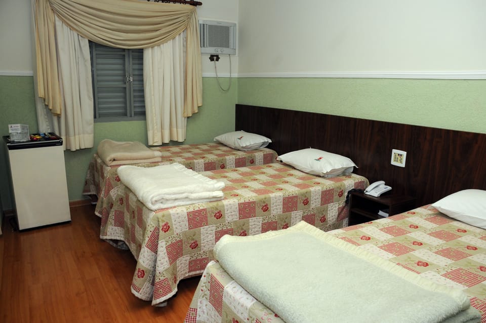 Triple Room | Minibar, desk, cribs (free), rollaway beds (free)