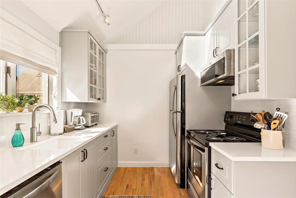 Remodeled kitchen with brand new appliances and quartz countertops. 