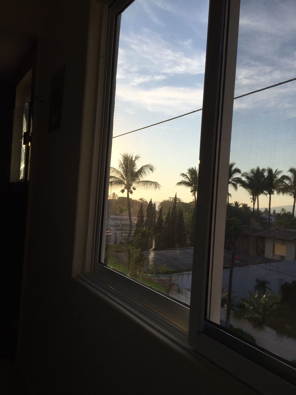 Looking out master bath window, sun setting 