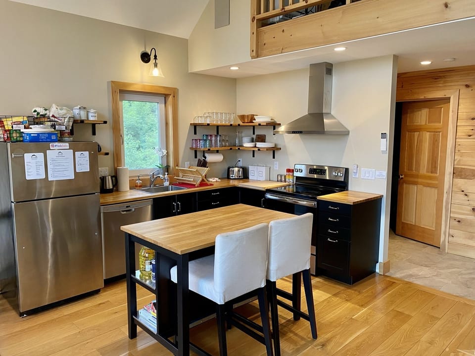 Kitchen with island for social cooking with friends or family