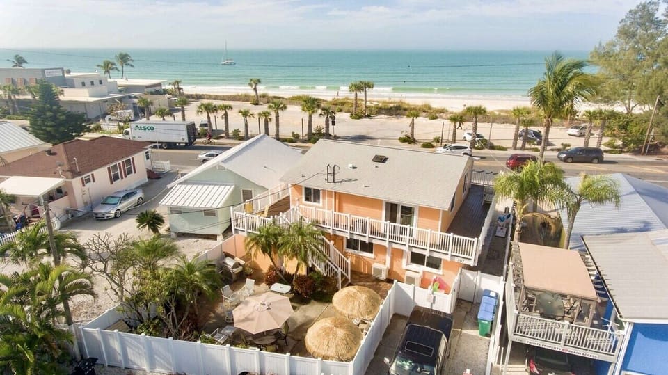 Aerial photo looking west at the property, balcony and beautiful Gulf of Mexico