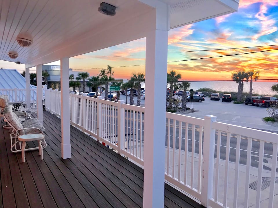 Sunset west balcony side has roof extension for any weather enjoyment.