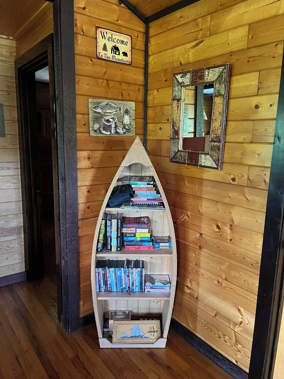 The canoe shelf is where you can find reading materials, games or DVD's