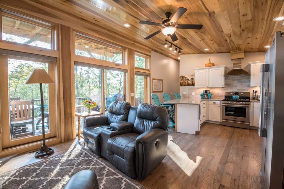 Living room and kitchen with bar make for easy mealtime.