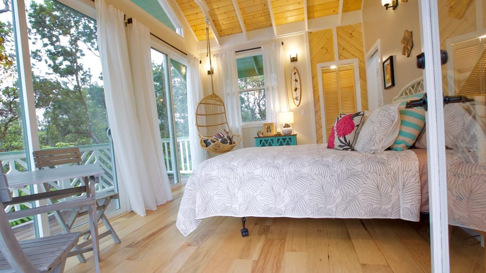 Entering the tree cottage; pine ceiling, hardwood floors, and 8" sliders. 
