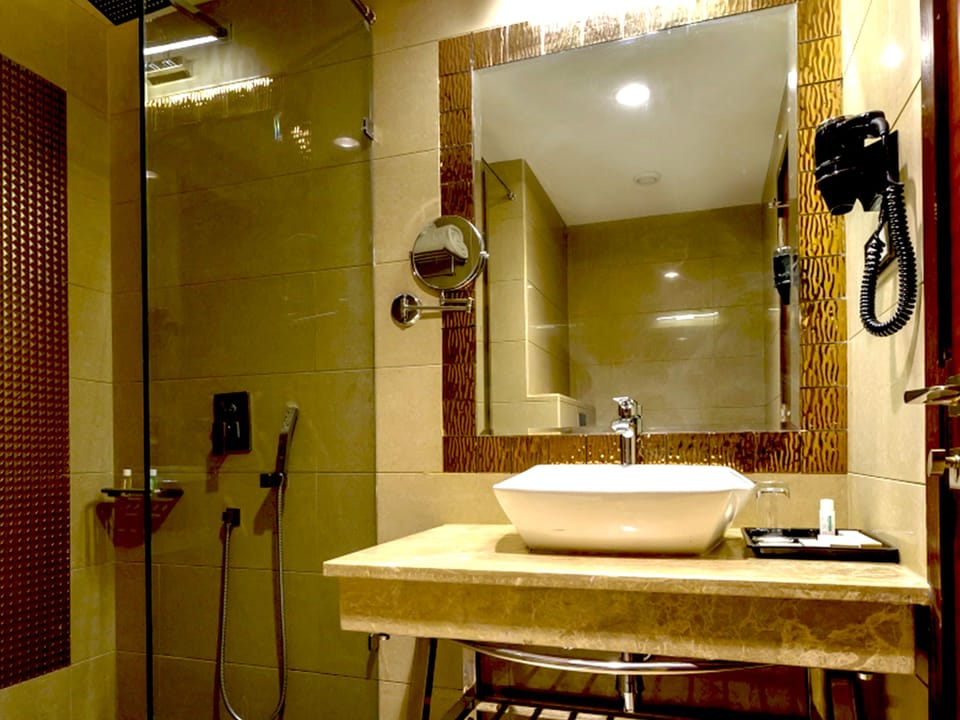 Luxury Suite, 1 Bedroom | Bathroom | Rainfall showerhead, free toiletries, hair dryer, slippers