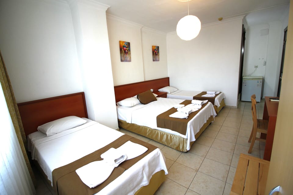 Standard Quadruple Room | Premium bedding, in-room safe, desk, laptop workspace