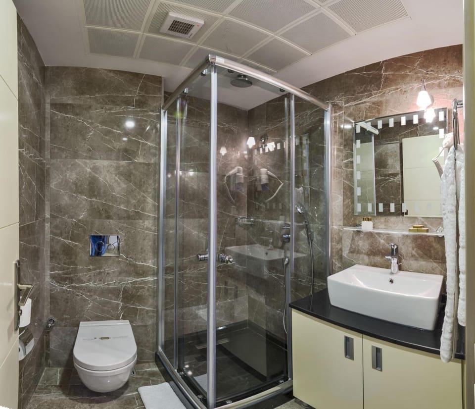 Shower, free toiletries, hair dryer, slippers