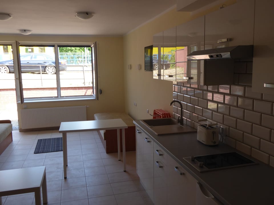 Economy Studio | Private kitchenette | Fridge, stovetop, electric kettle, cookware/dishes/utensils