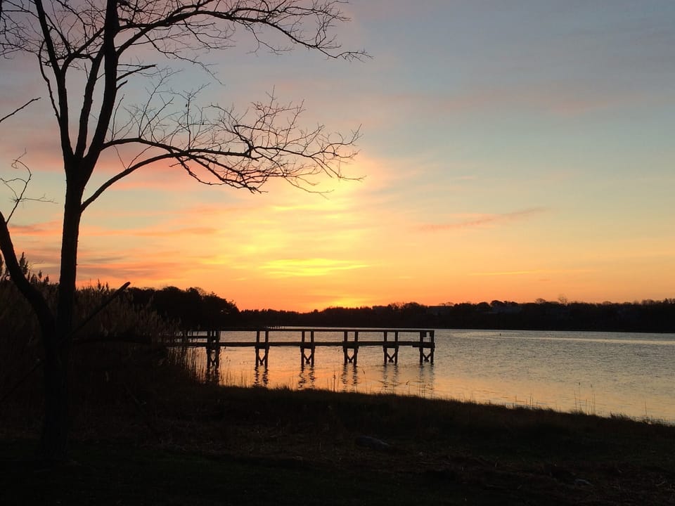 Sunrise across the cove from our yard.