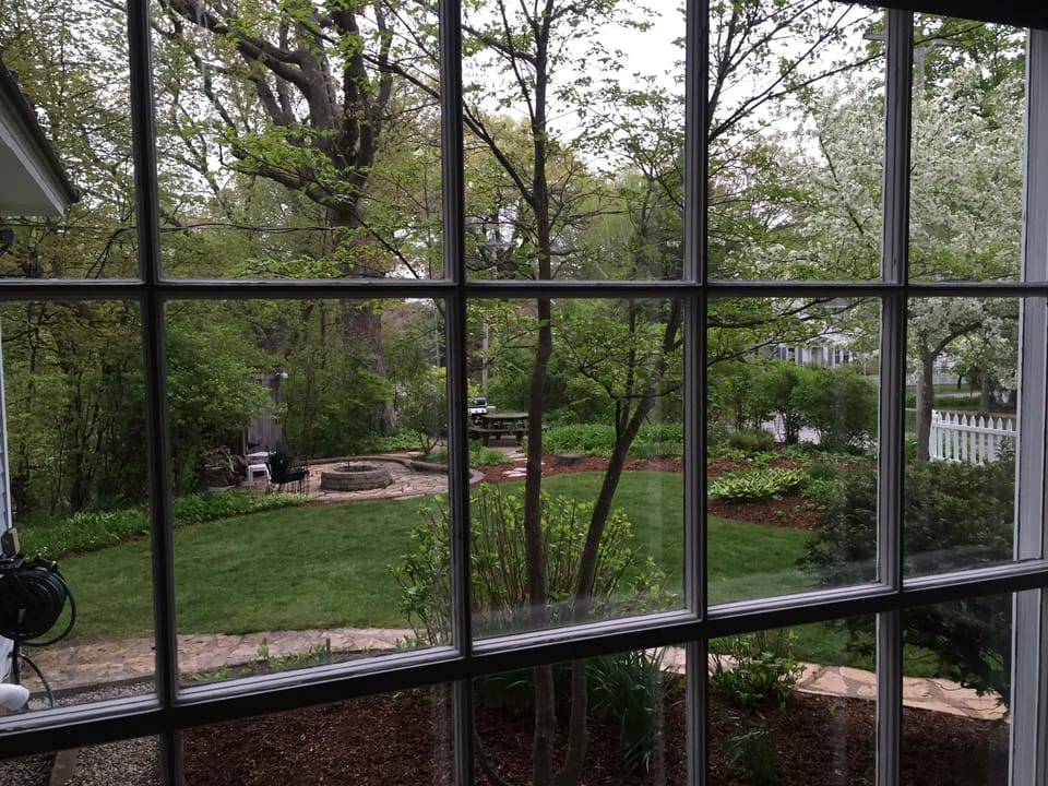 View of fire pit, and barbeque area from the dinning room