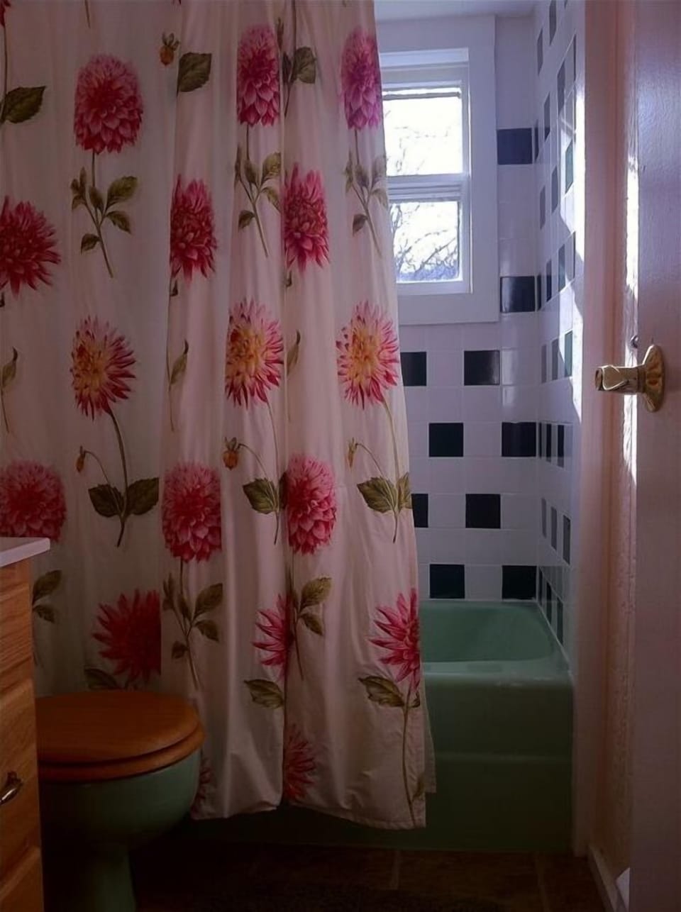 Beautiful sunny bath with a deep tub for soaking.