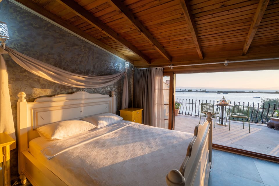 Deluxe Room, Terrace, Sea View | Premium bedding, minibar, in-room safe, iron/ironing board