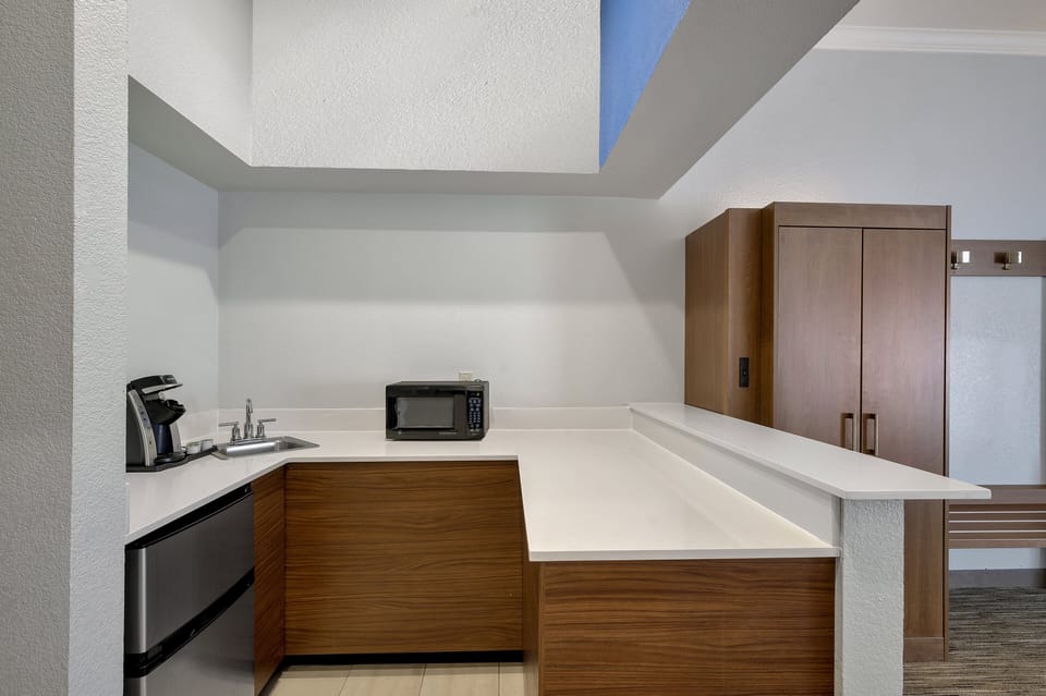 Suite, 1 King Bed (Additional Kitchen Area) | Blackout drapes, iron/ironing board, WiFi (free), bed sheets