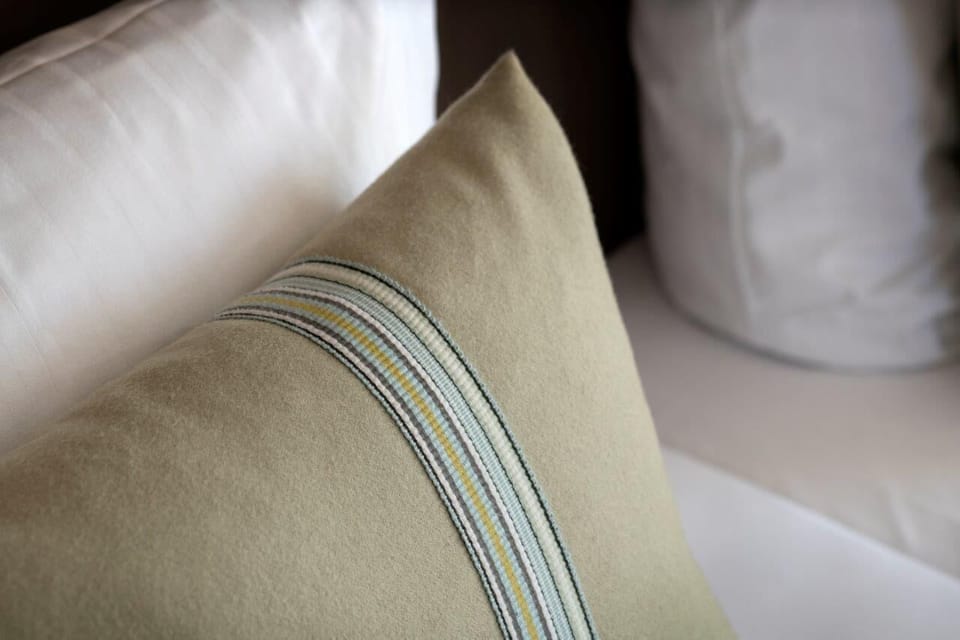 Premium bedding, down comforters, pillowtop beds, in-room safe