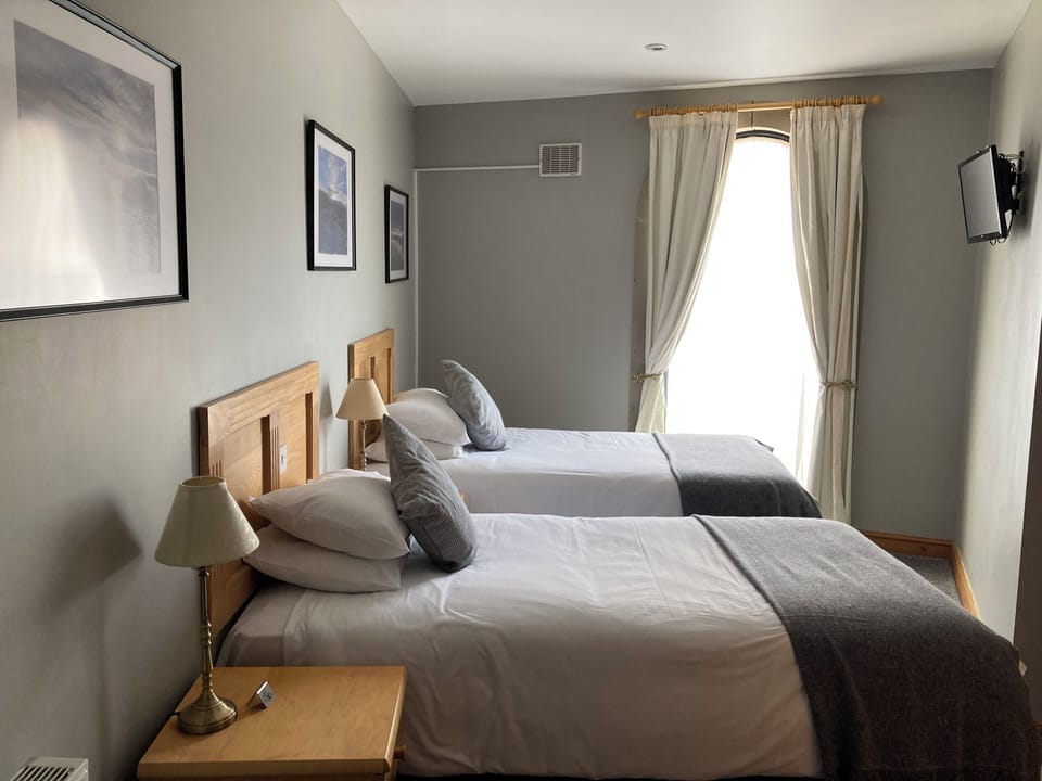 Twin Room | Desk, blackout drapes, iron/ironing board, cribs/infant beds
