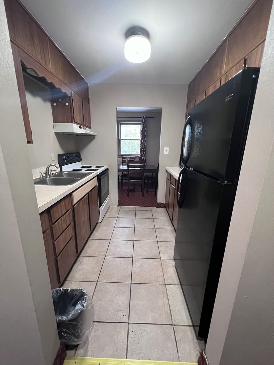 One King Bed, Two Double Beds,  Two Bedroom Suites, Non-Smoking | Private kitchen | Mini-fridge, microwave, oven, coffee/tea maker