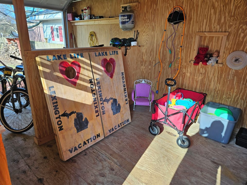 corn hole boards,beach wagon and lots of beach toys ,balls, frisbees ,sand toys.