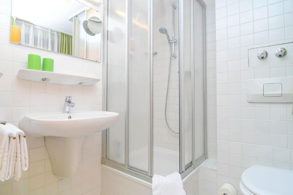 Shower, free toiletries, hair dryer, towels