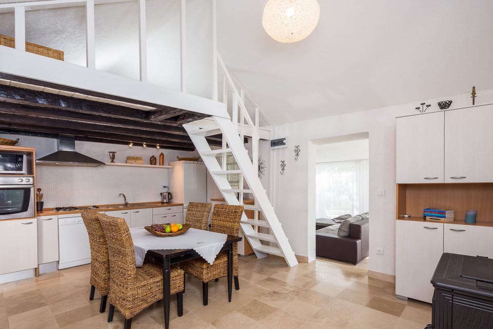 Kitchen, dining room and stairs to loft