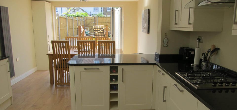 Kitchen/diner with bi-fold doors to garden