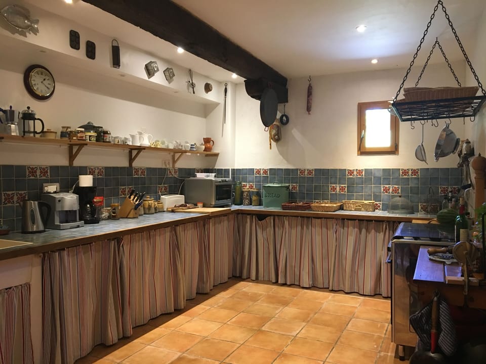 Kitchen has 5 ring gas range, American  2 door fridge with ice & water dispenser