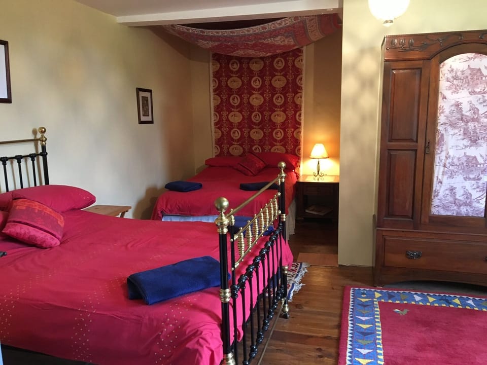 Family bedroom with two double beds