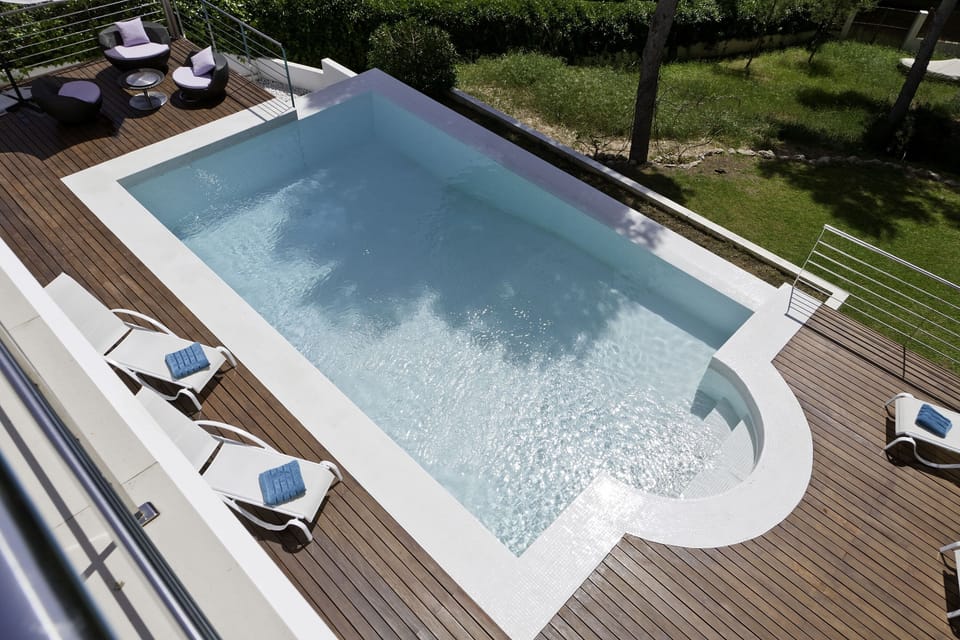 view of pool from upper balcony
