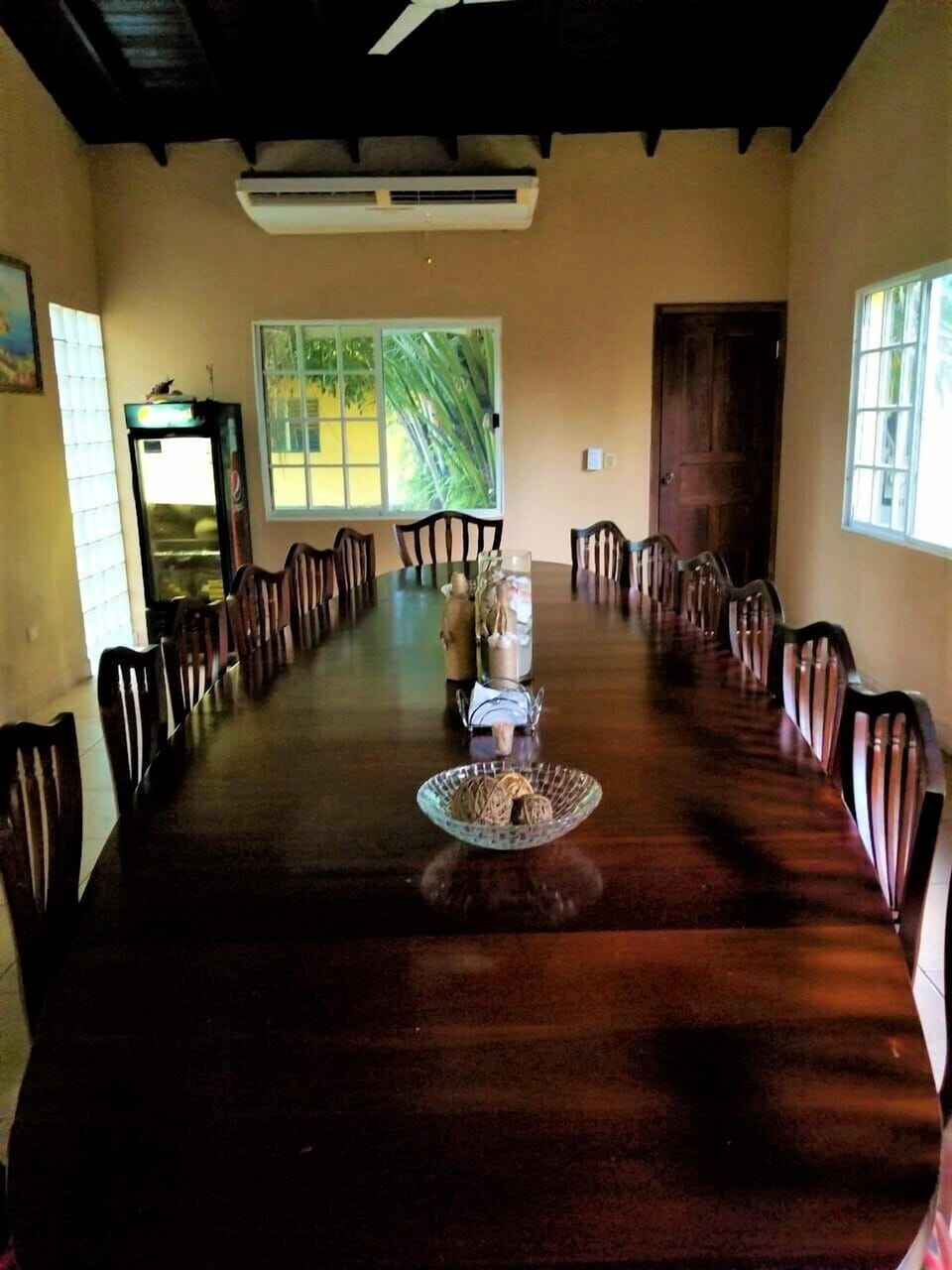 Large redecorated dining room with Louis XV mahogany table for 16 people.