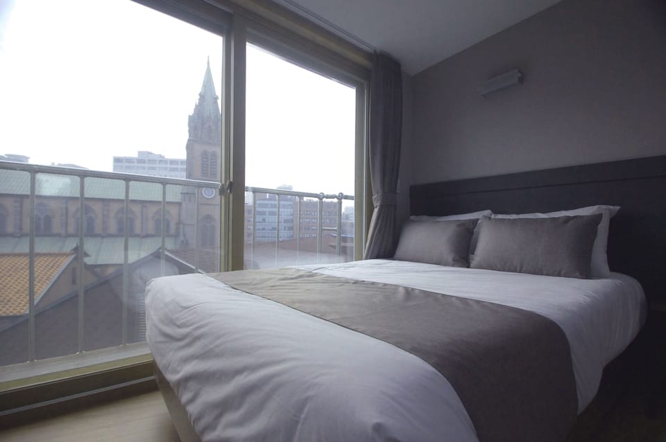 Deluxe Quadruple Room, 2 Double Beds, Non Smoking, City View | Desk, soundproofing, free WiFi, bed sheets