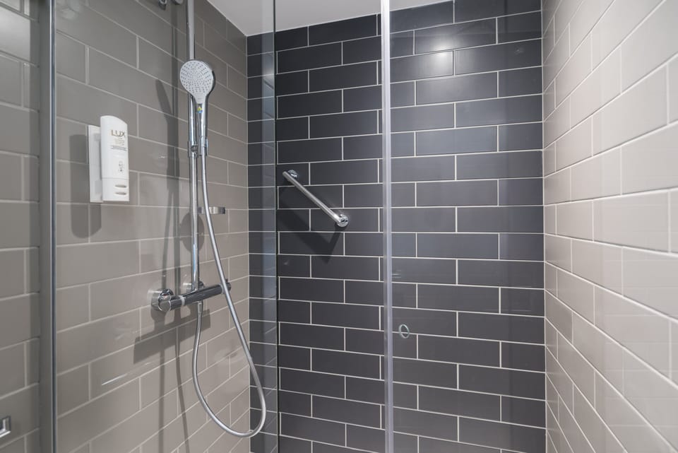 Shower, eco-friendly toiletries, hair dryer, towels