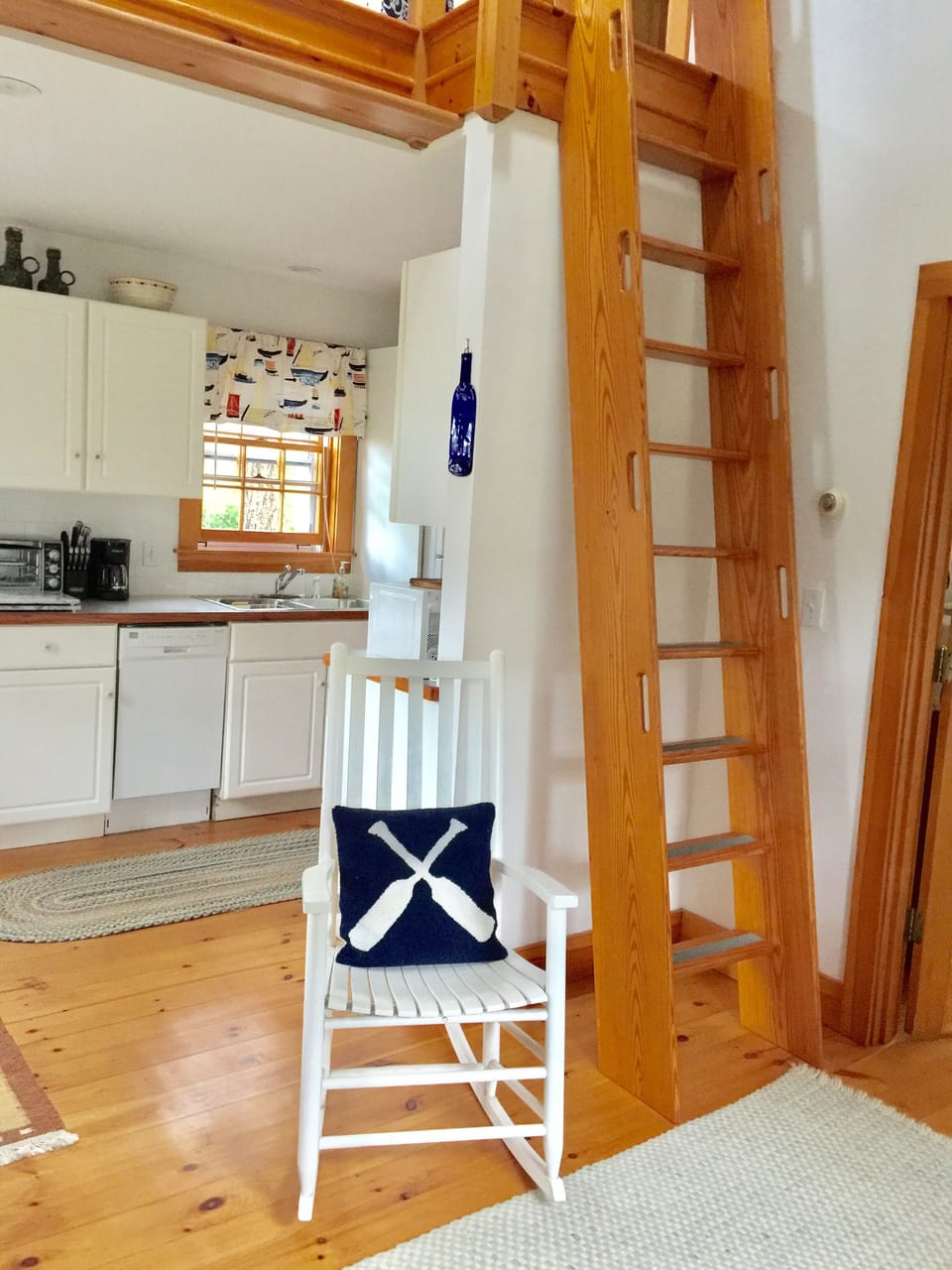Nautical captain’s ladder to access the upstairs sitting area and master bedroom