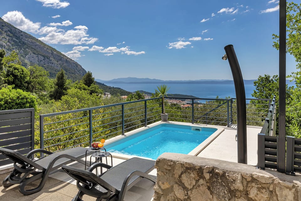 Pool area with the sea and city view