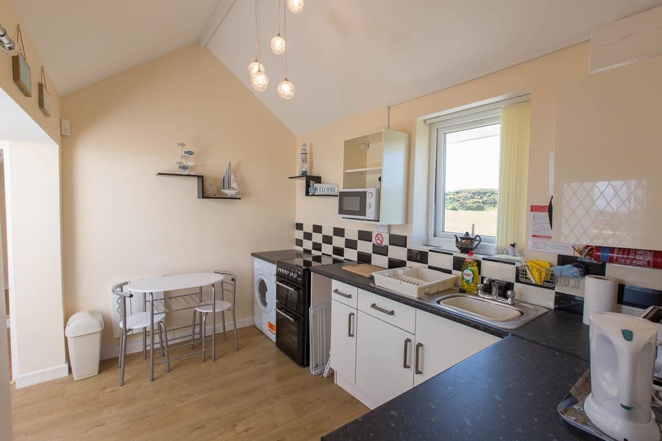 Breakfast table,crockery,cutlery,cleaning products, tea towels,dish cloth etc.