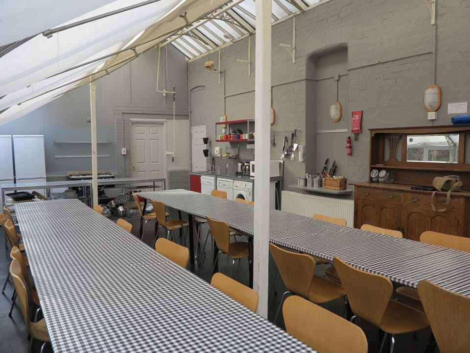 Huge social kitchen & dining space, tables for everyone to be together 