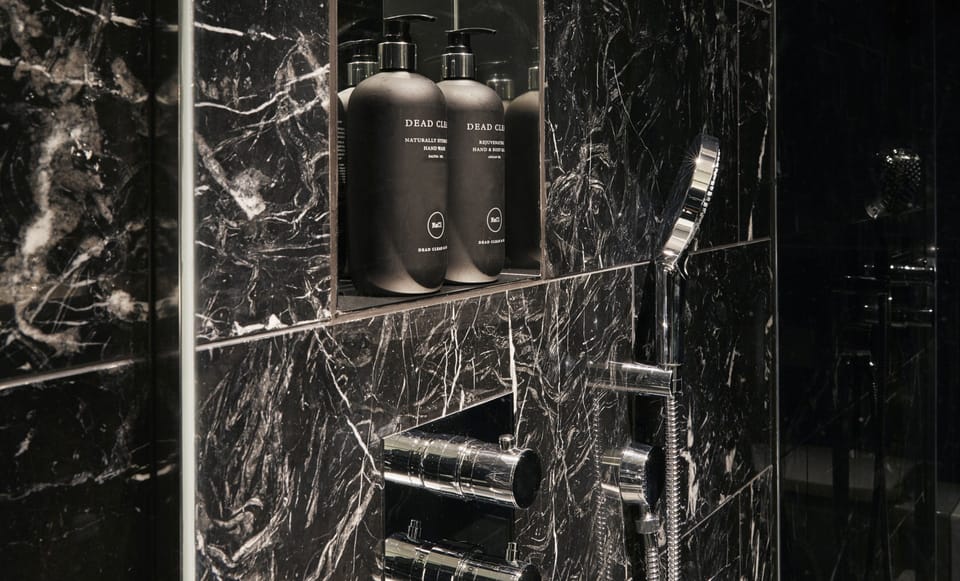 Separate tub and shower, rainfall showerhead, free toiletries