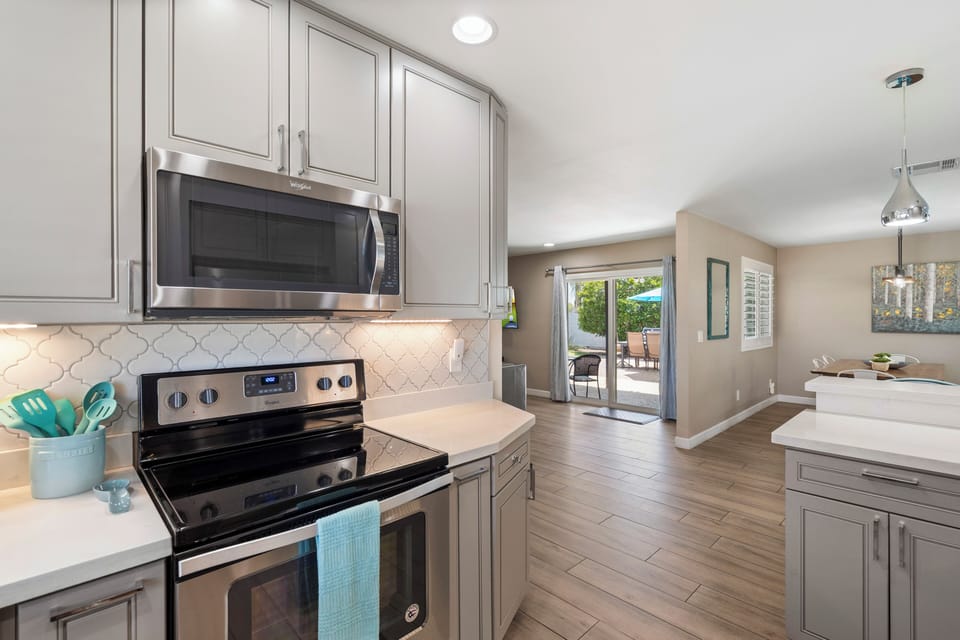 Modern Kitchen with white quartz countertops and Stainless appliances