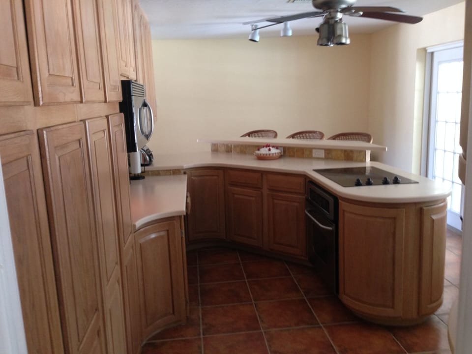 Plenty of cabinets, in the fully stocked kitchen.