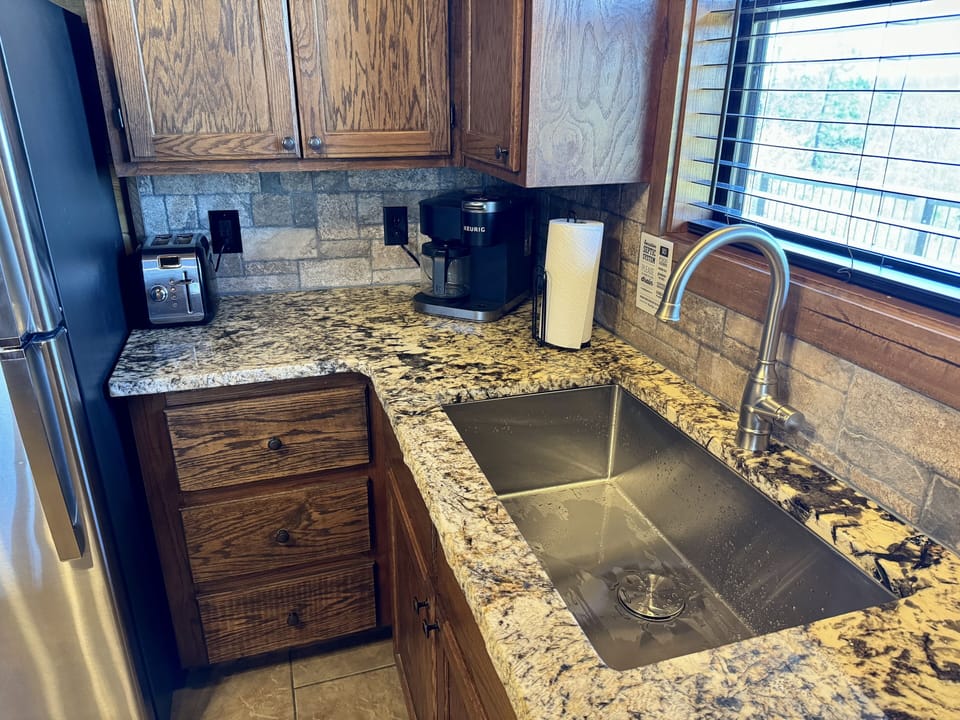 Fully equipped luxury kitchen with a Keurig that can take K-cups and grounds. 